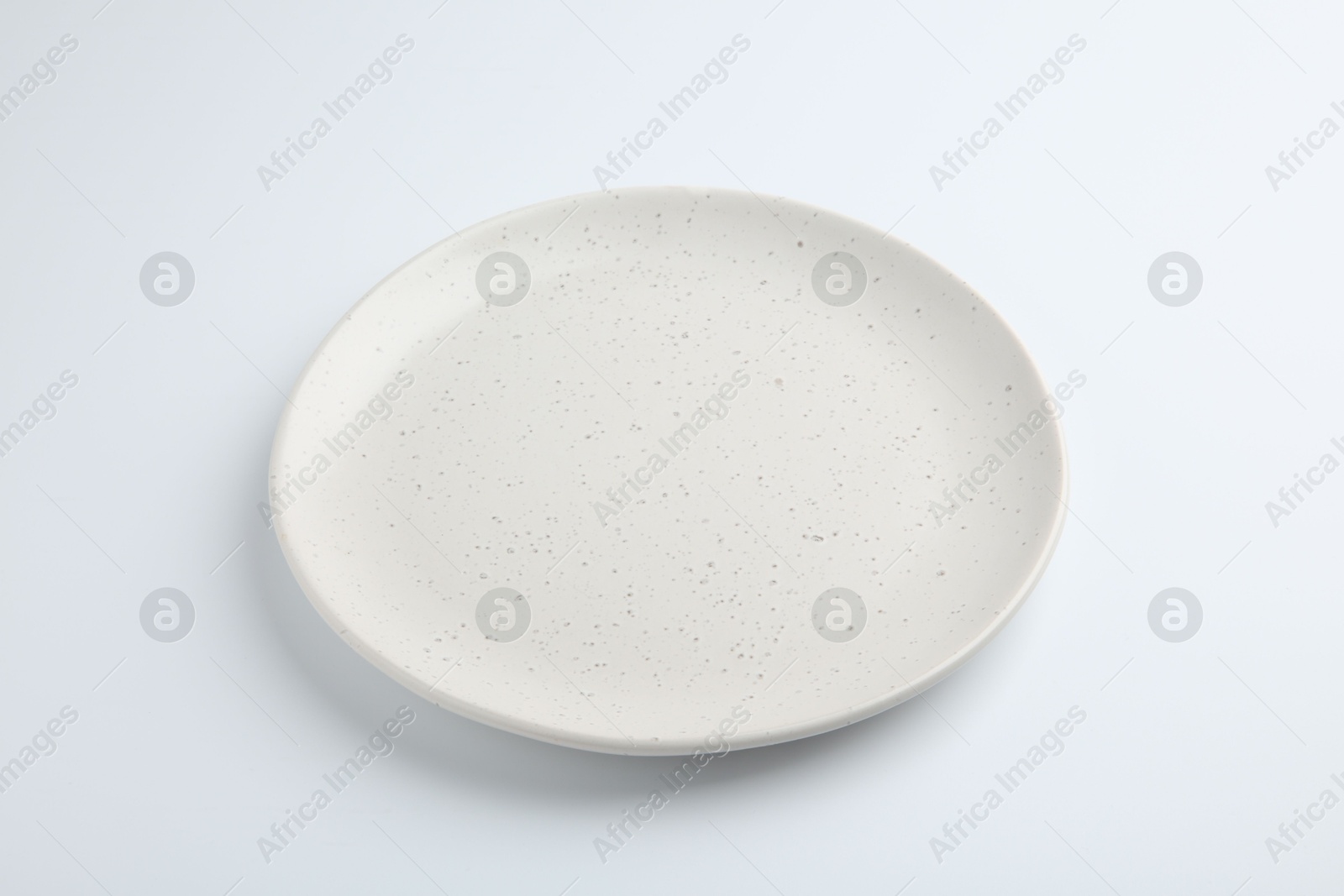 Photo of One empty ceramic plate isolated on white