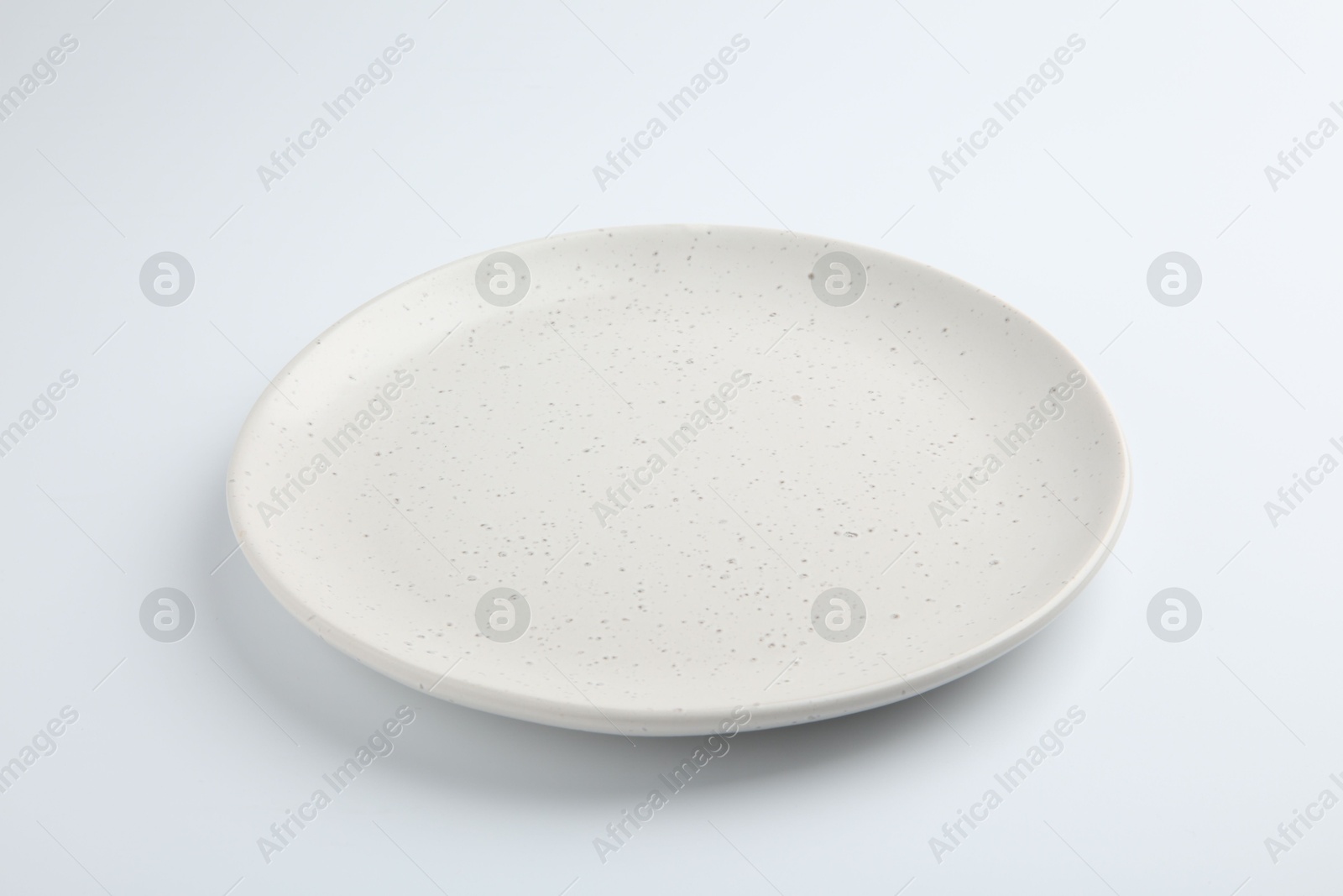 Photo of One empty ceramic plate isolated on white