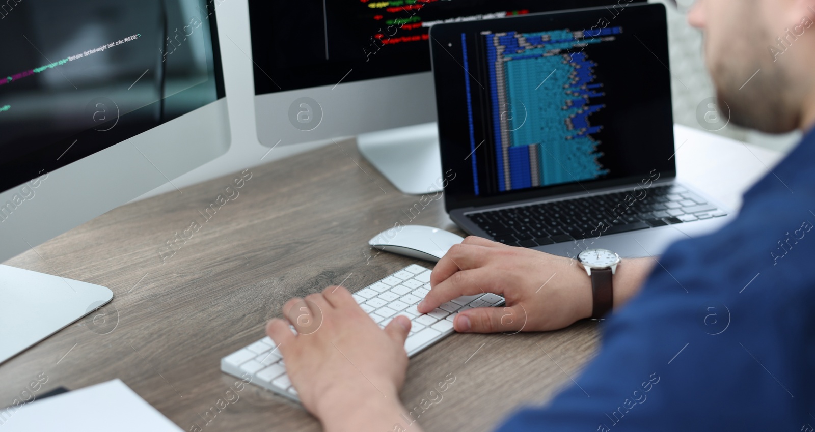 Image of Programmer working with computer at desk in office, closeup. Banner design