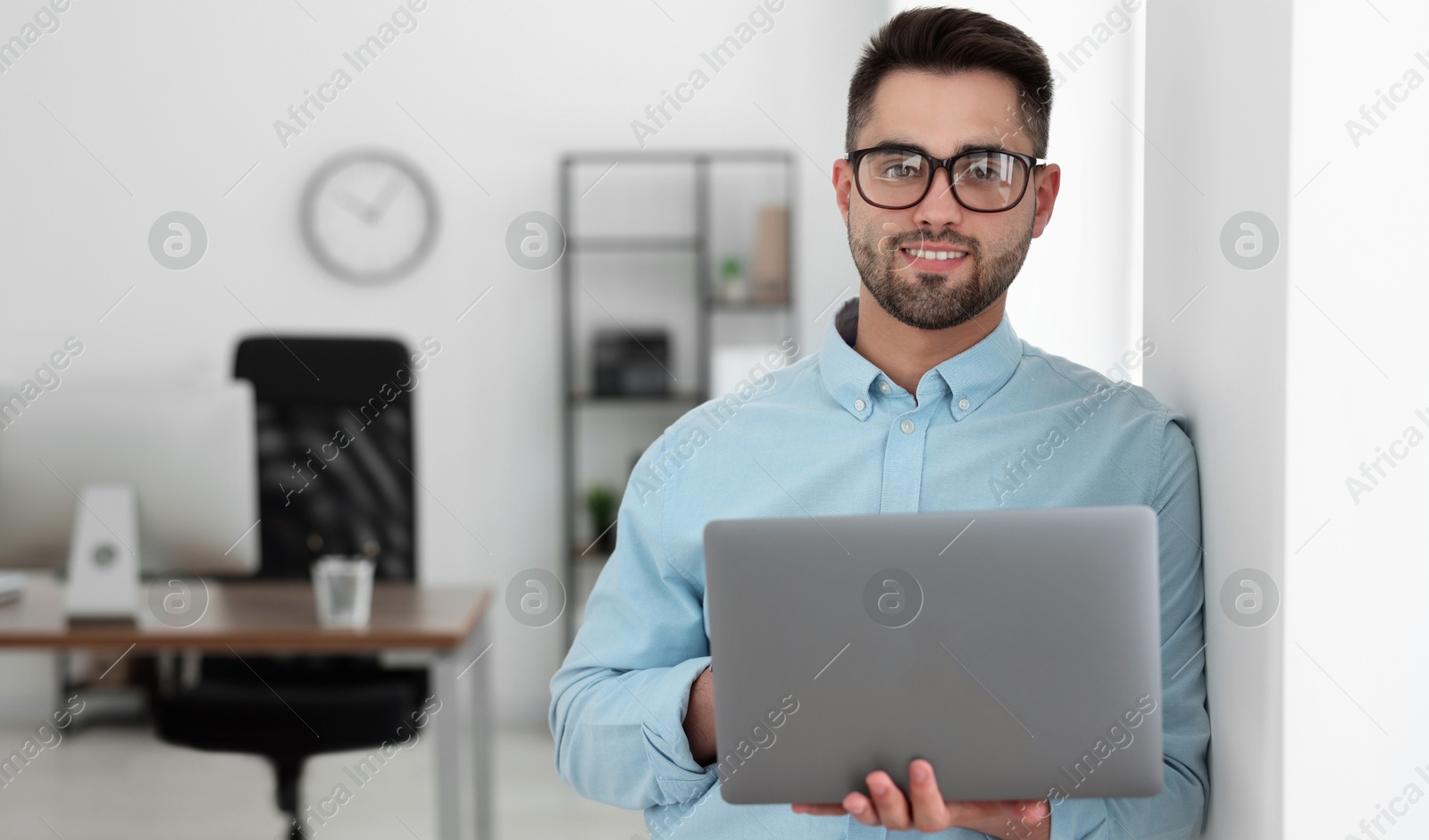 Image of Programmer with laptop in office. Banner design