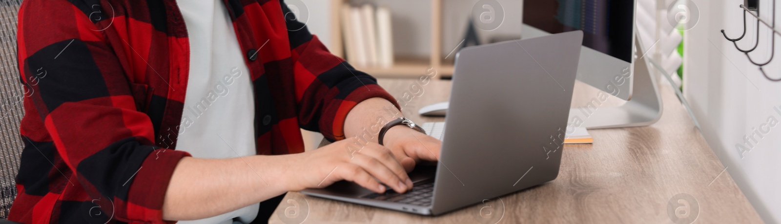 Image of Programmer working with laptop in office, closeup. Banner design