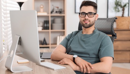 Programmer working at desk in office. Banner design