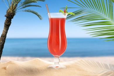 Image of Summer beach with delicious cocktail, palm trees and golden sand