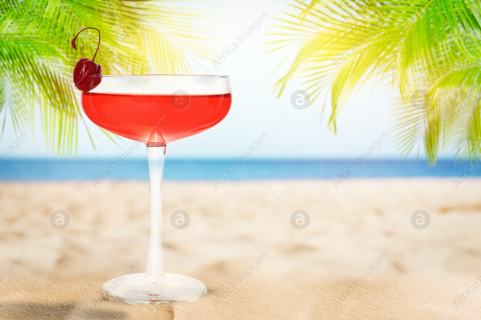 Image of Summer beach with delicious cocktail, palm trees and golden sand, space for text