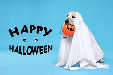 Happy Halloween card with dog in ghost costume on light blue background