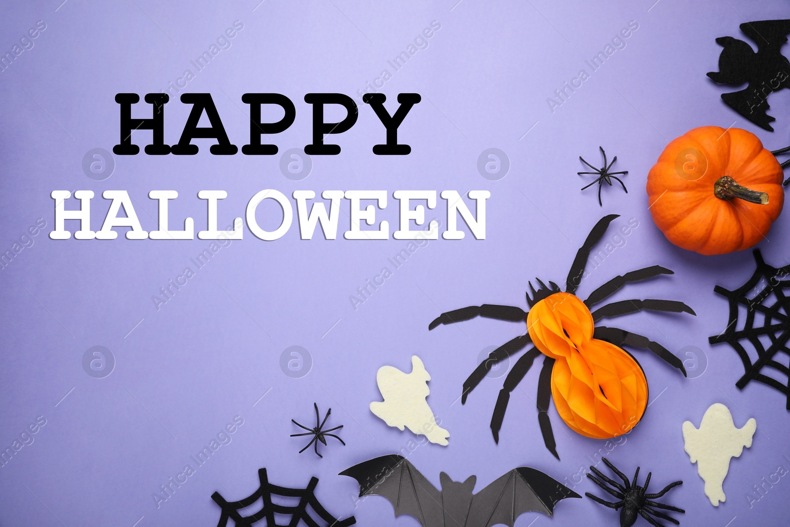 Image of Happy Halloween text and spooky decor on violet background, top view. Greeting card