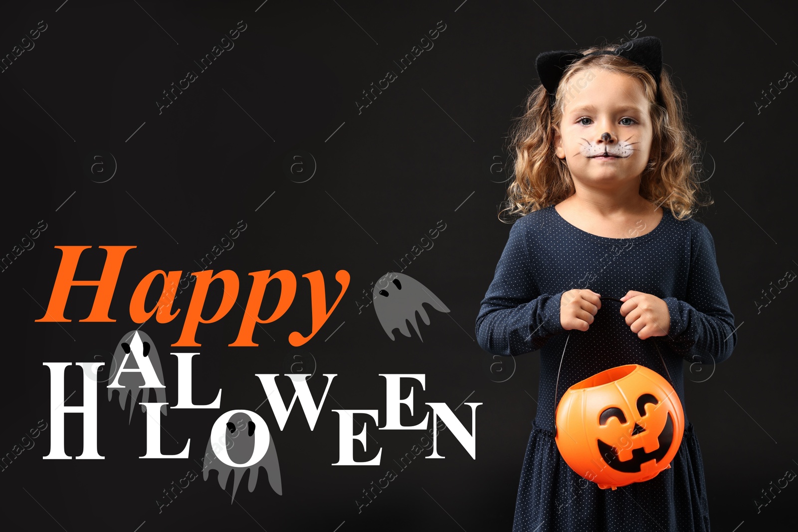 Image of Happy Halloween card. Girl dressed like cat holding pumpkin bucket on black background