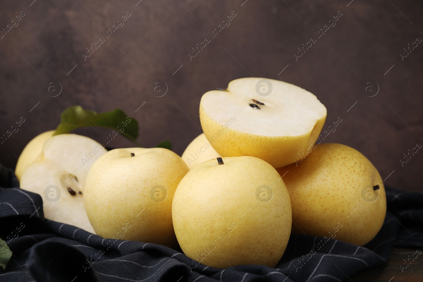 Photo of Many delicious fresh apple pears on table, closeup