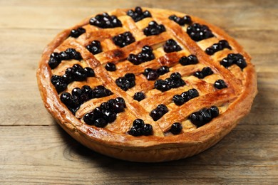 Tasty homemade pie with blueberries on wooden table, closeup