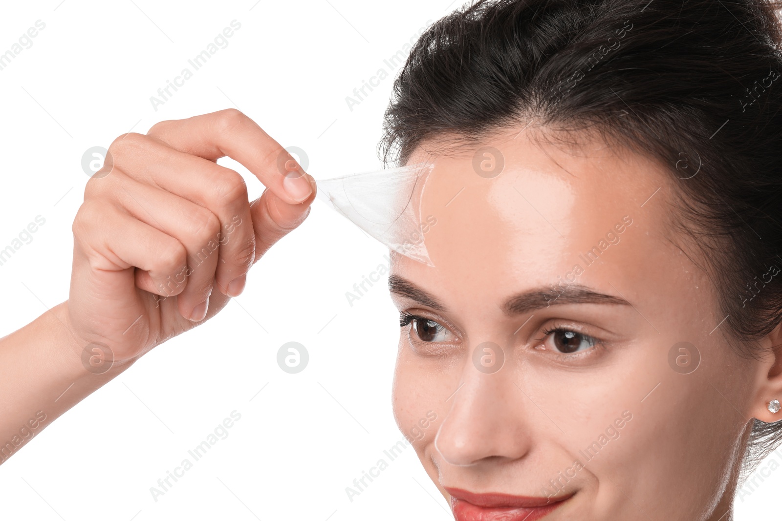 Photo of Beautiful woman peeling off face mask on white background, closeup