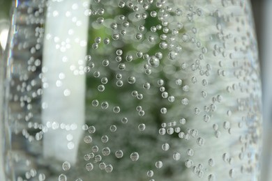 Photo of Fresh soda water in glass, closeup view