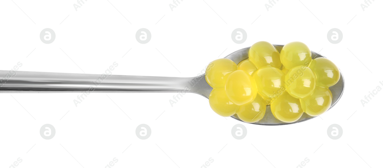 Photo of Bright tapioca pearls in spoon isolated on white, top view