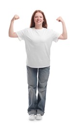 Teenage girl showing muscles on white background