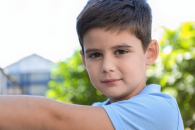 Portrait of little boy outdoors. Cute child