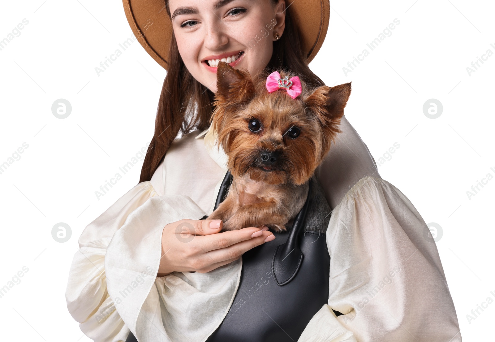 Photo of Beautiful young holding bag with cute Yorkshire Terrier dog isolated on white