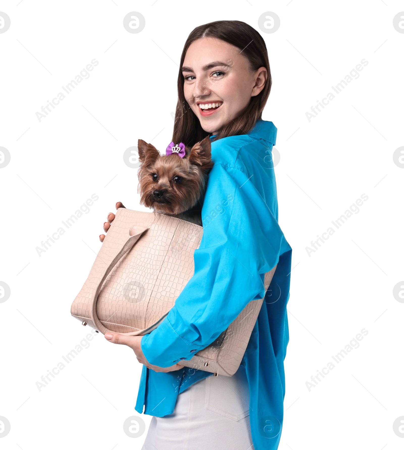 Photo of Beautiful young woman holding bag with cute Yorkshire Terrier dog isolated on white