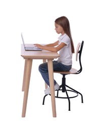 Girl with correct posture using laptop at wooden desk on white background