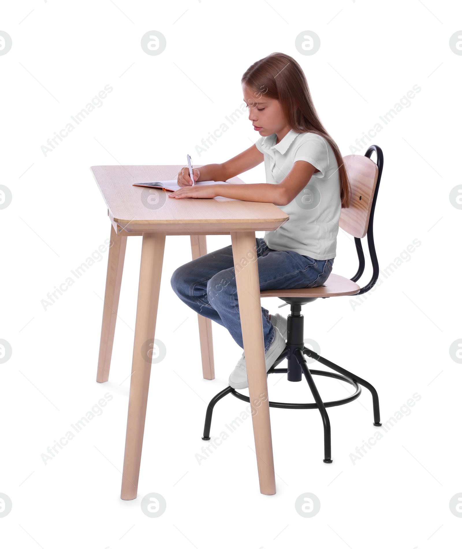 Photo of Girl with incorrect posture and notebook sitting at wooden desk on white background