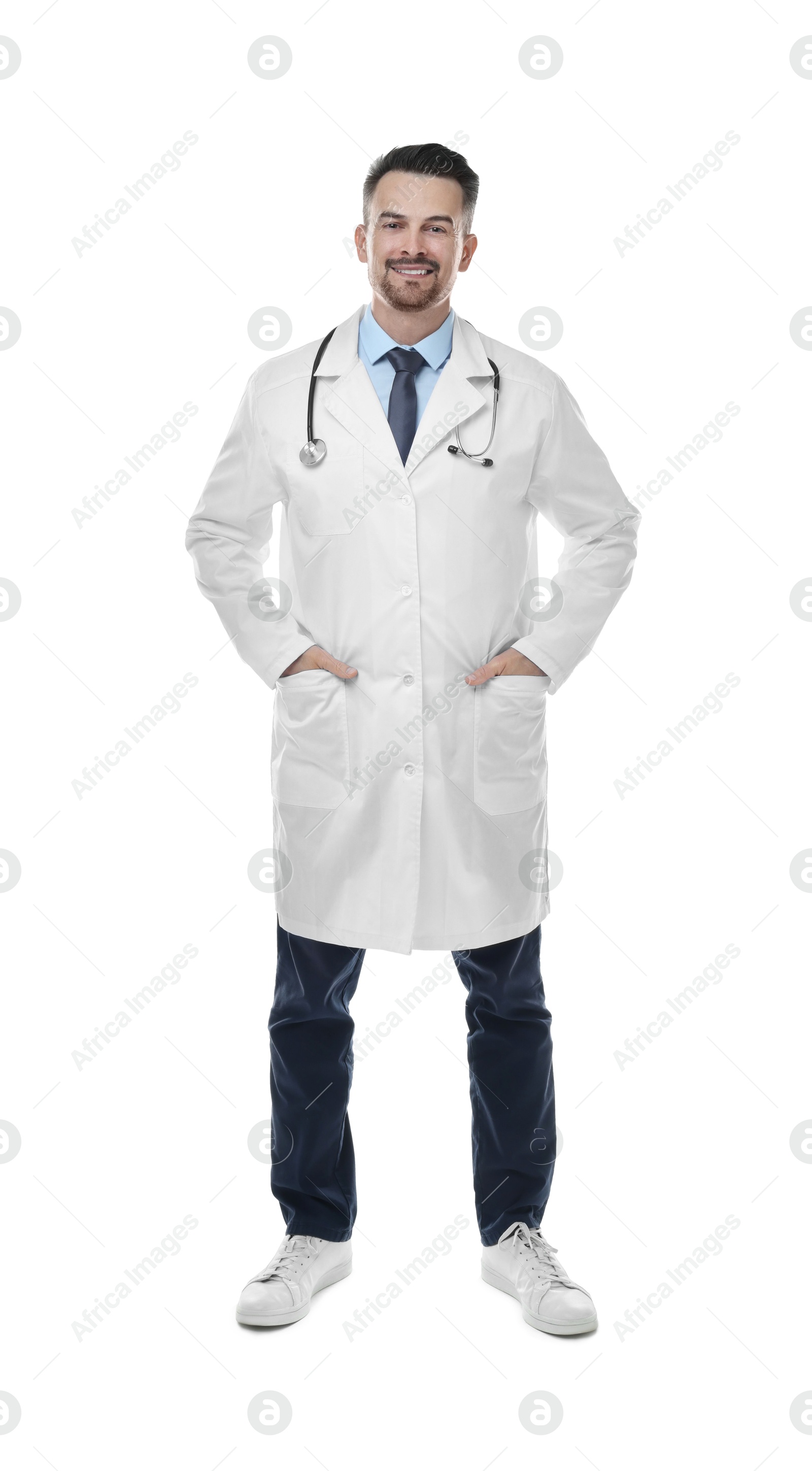 Photo of Smiling doctor with stethoscope isolated on white