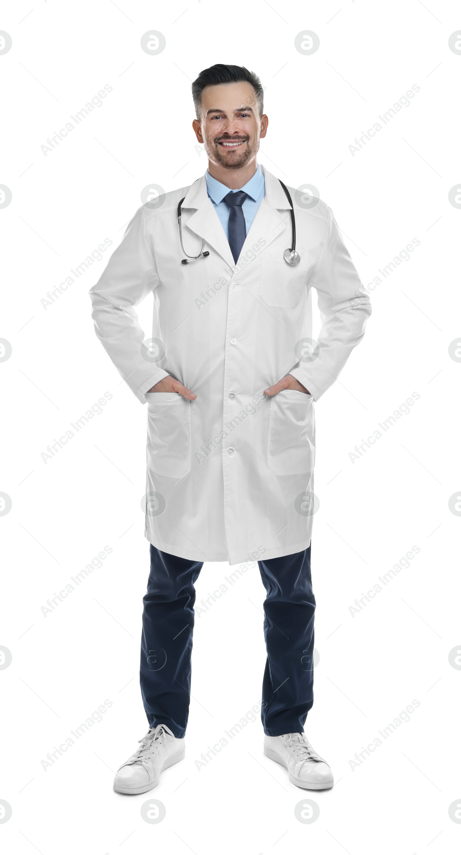 Photo of Smiling doctor with stethoscope isolated on white