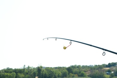 One fishing rod against blue sky outdoors