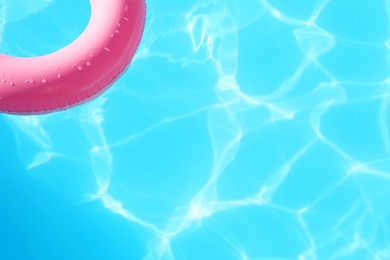 Photo of Pink inflatable ring in swimming pool outdoors