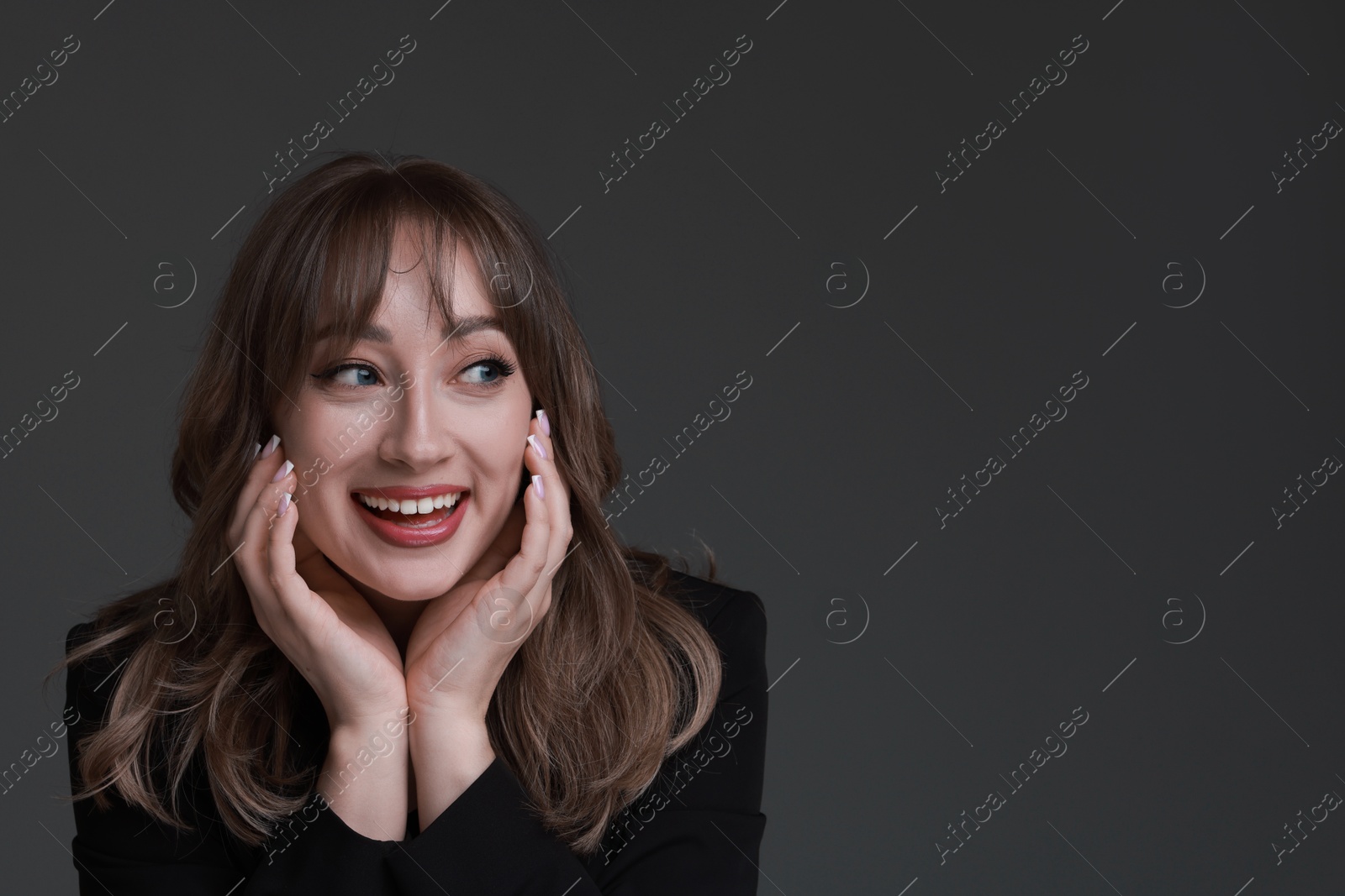 Photo of Attractive woman with stylish haircut on grey background, space for text