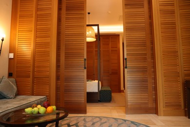 Stylish wooden sliding doors in hotel room