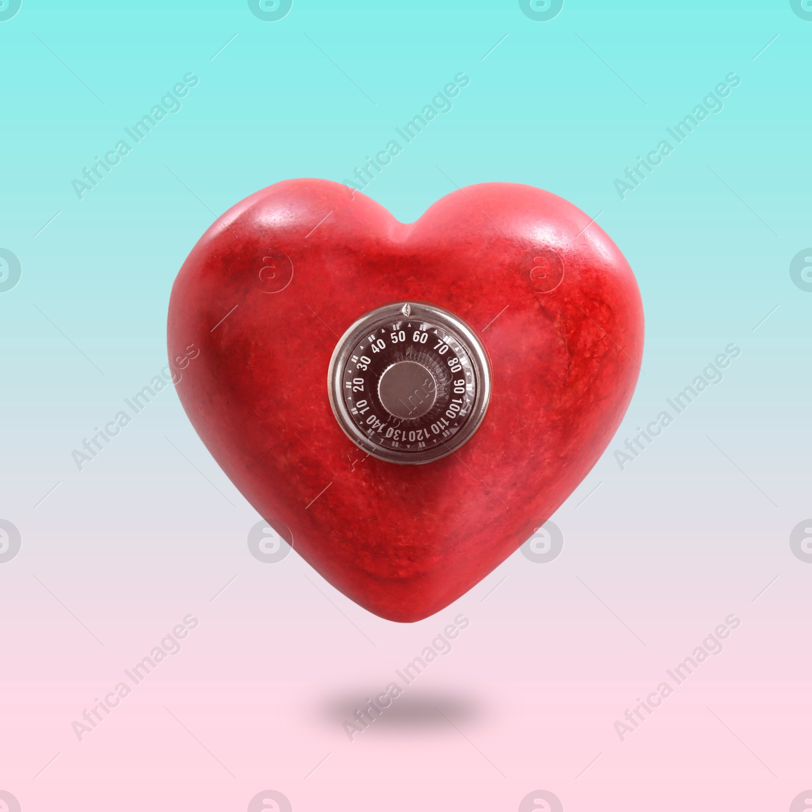 Image of Red heart with mechanical safe lock on gradient background