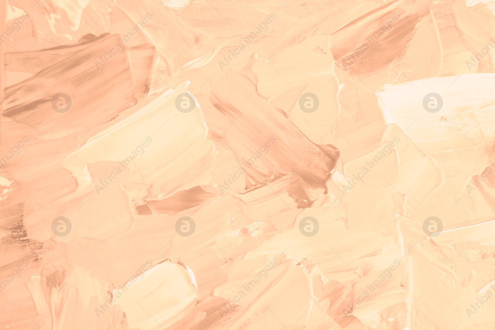 Image of Peach fuzz color paint strokes as background, closeup