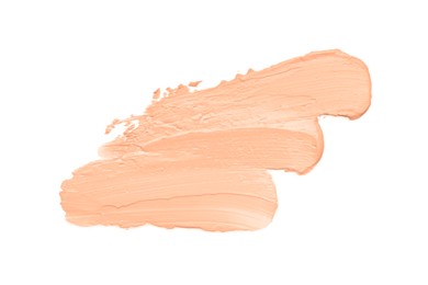 Image of Skin foundation on white background, top view. Peach fuzz color