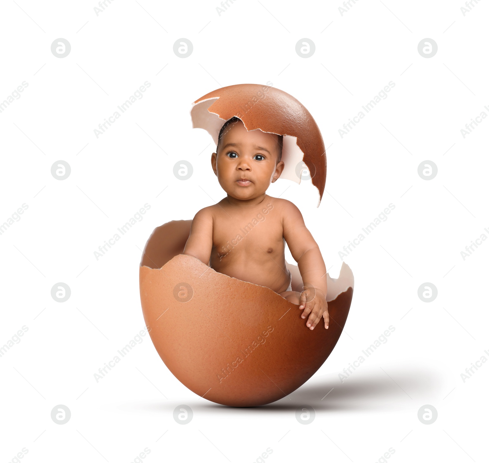 Image of Cute little baby in eggshell on white background