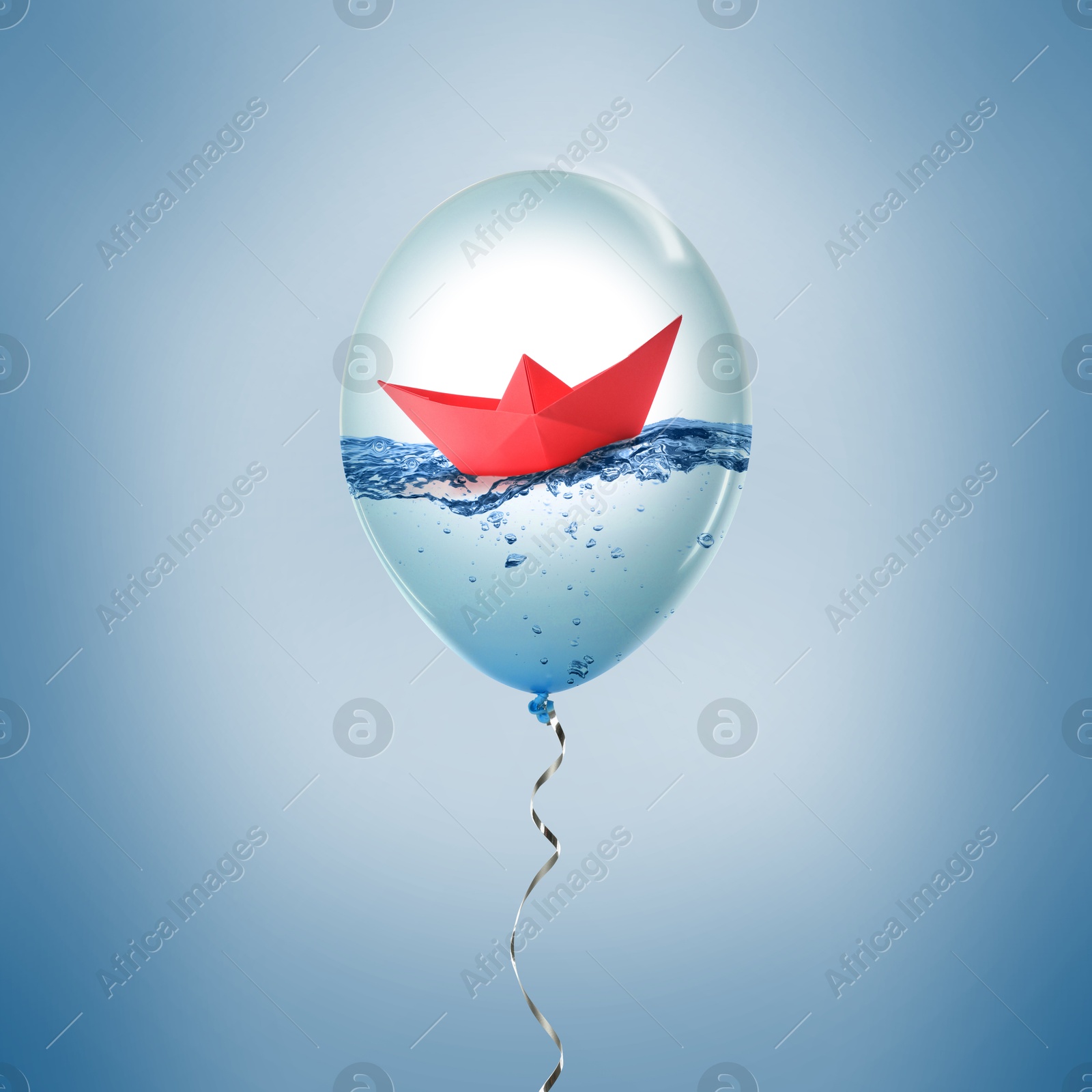 Image of Paper boat floating on water inside balloon against light blue background