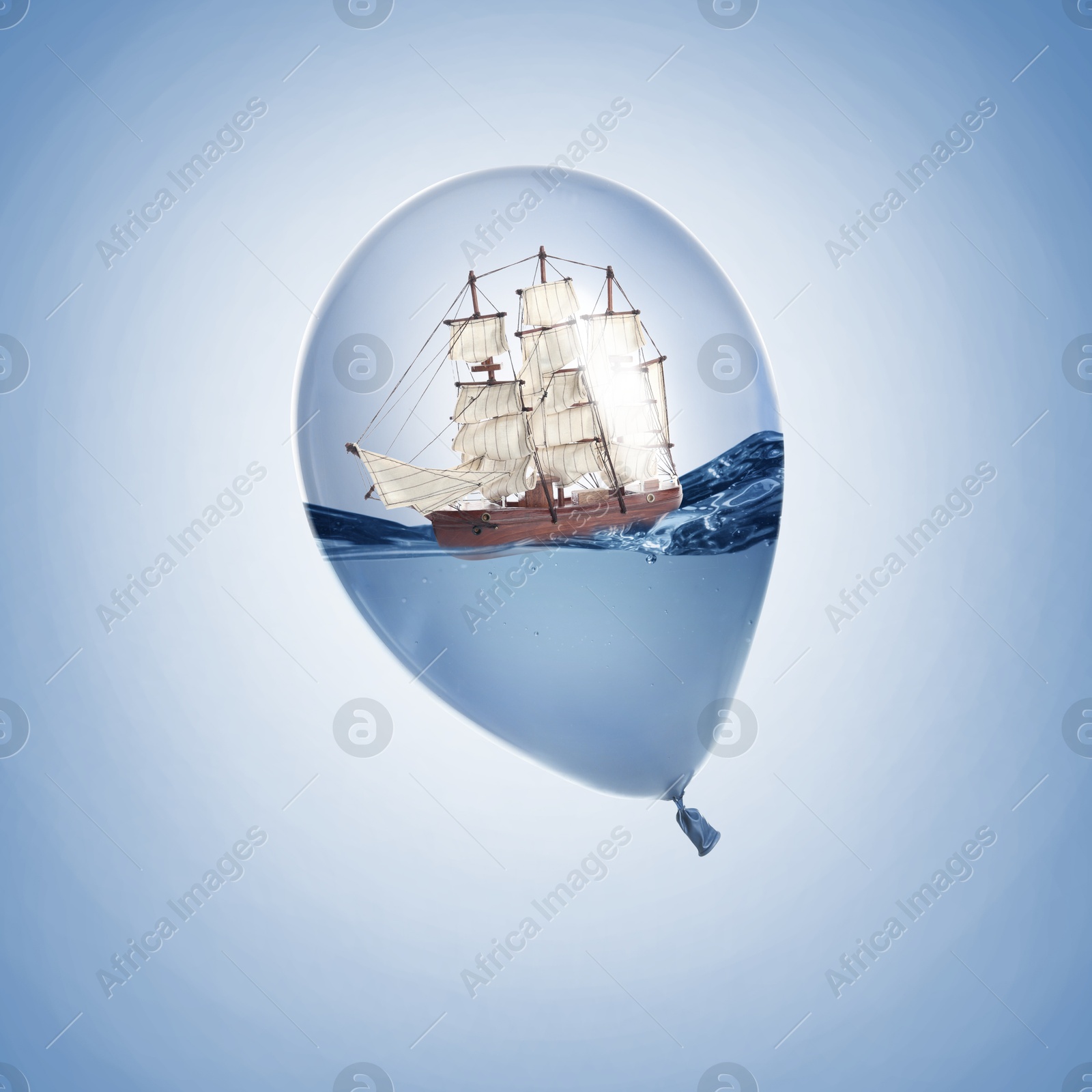 Image of Ship floating on water inside balloon against light blue background