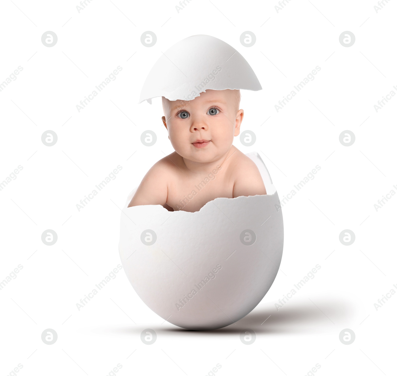 Image of Cute little baby in eggshell on white background