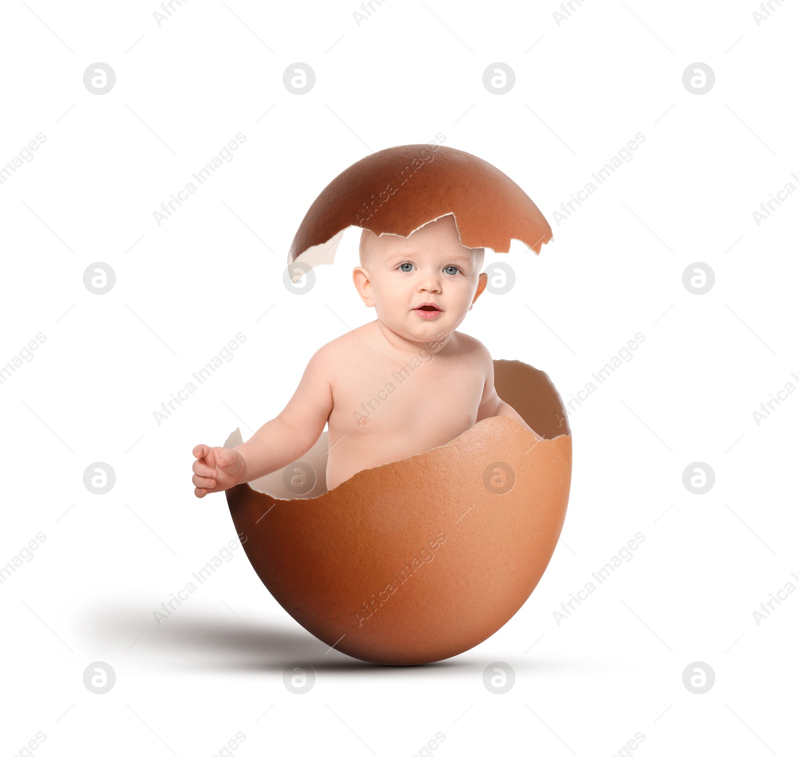 Image of Cute little baby in eggshell on white background