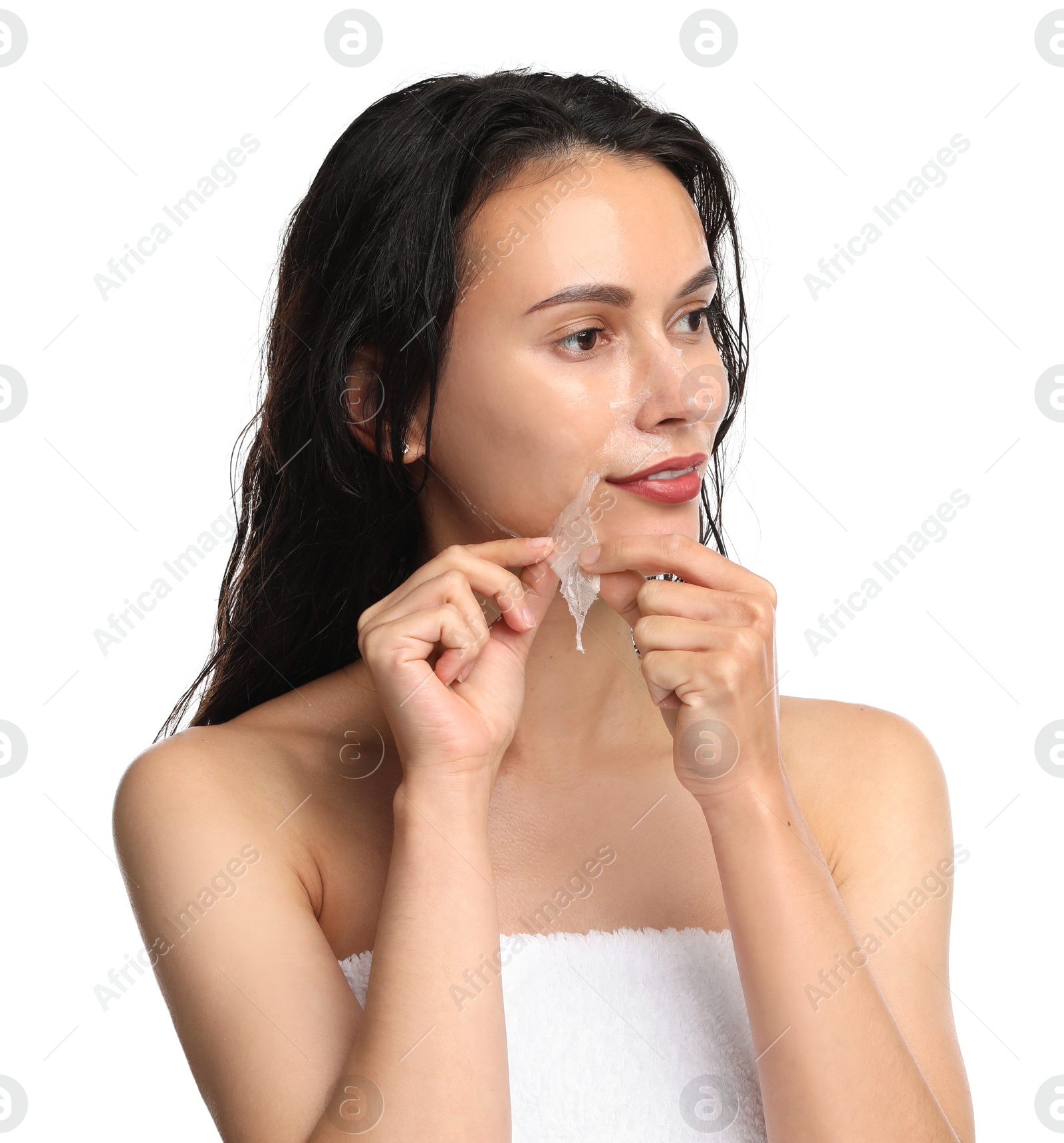 Photo of Beautiful woman peeling off face mask on white background