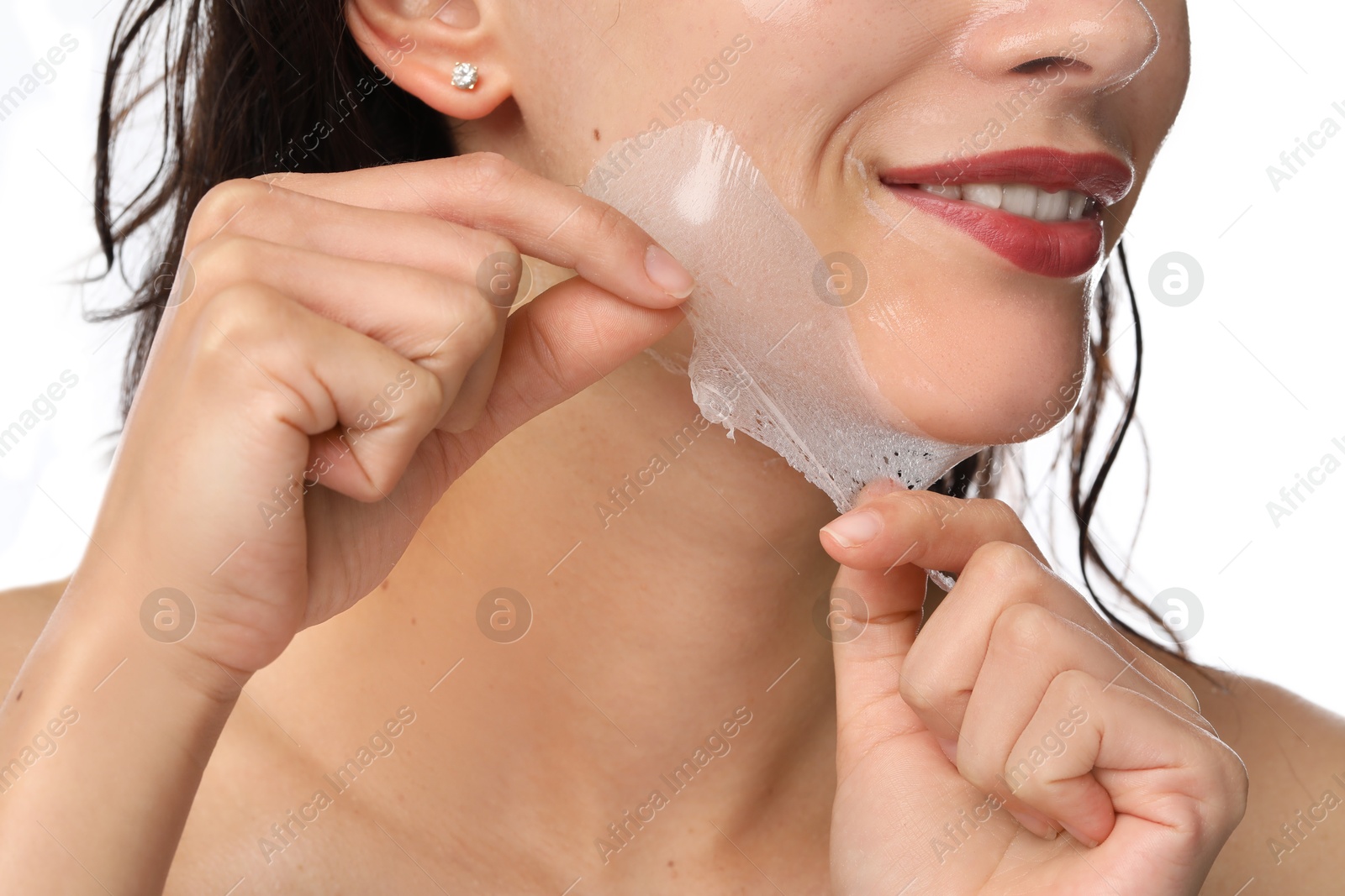 Photo of Woman peeling off face mask on white background, closeup