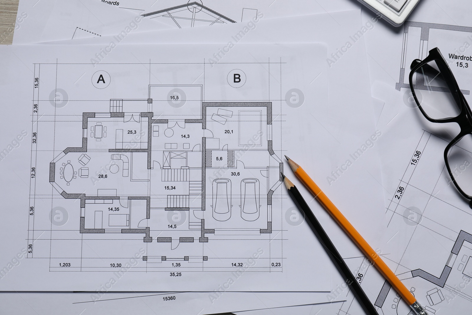 Photo of Different architectural drawings, glasses and pencils, top view