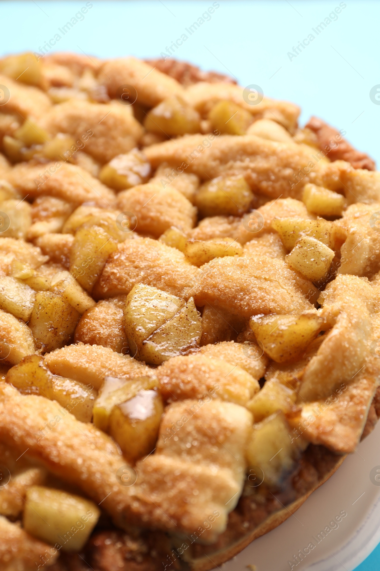 Photo of Tasty homemade apple pie on light background, closeup