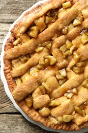 Homemade apple pie on wooden table, top view