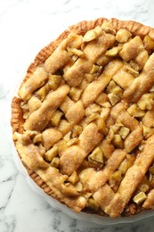 Photo of Homemade apple pie on white marble table, top view