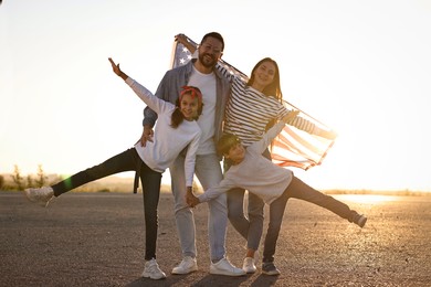 Happy family with flag of USA outdoors