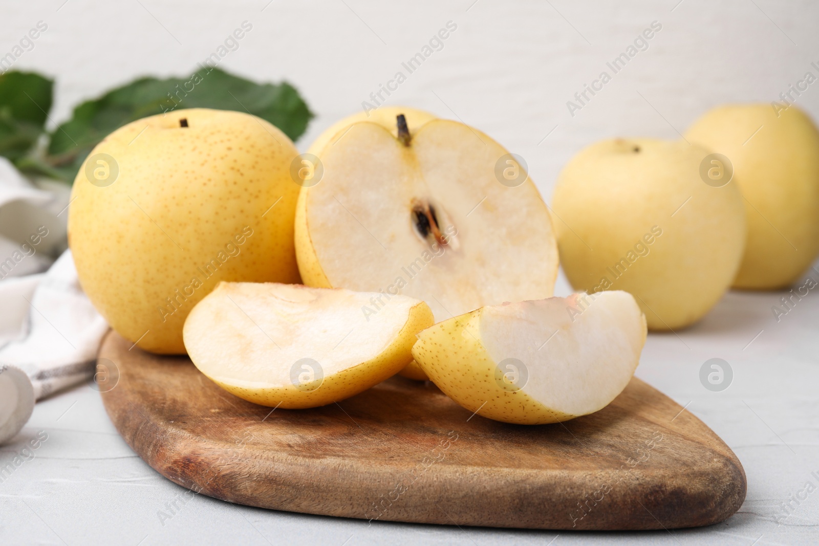 Photo of Delicious fresh apple pears on white table, closeup