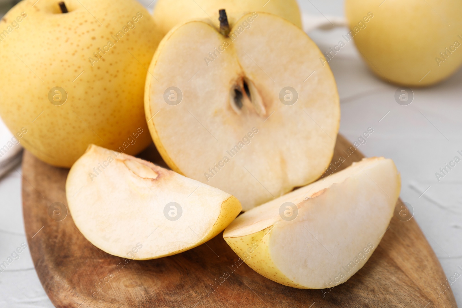 Photo of Delicious fresh apple pears on white table, closeup