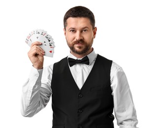 Professional croupier with playing cards on white background