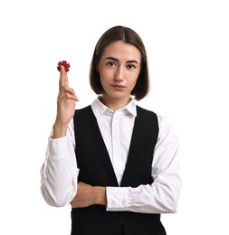 Photo of Professional croupier with casino chip on white background