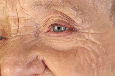 Senior woman with beautiful eyes, closeup view