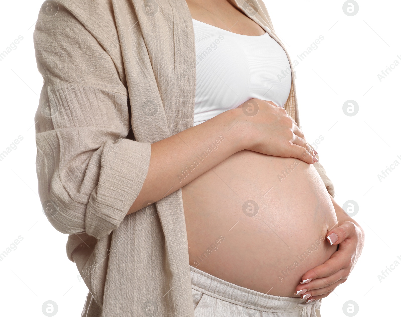 Photo of Young pregnant woman on white background, closeup