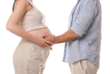 Photo of Pregnant woman with her husband isolated on white, closeup